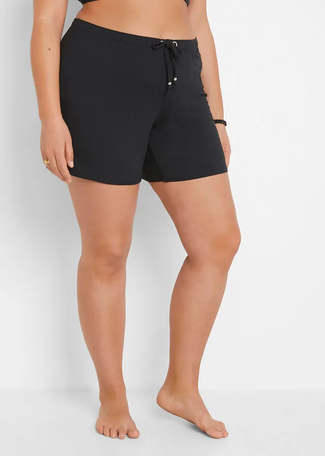 PANTALóN CORTO PLAYERO NEGROBEIGE CON ESTAMPADO DE CEBRA