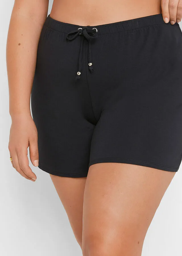 PANTALóN CORTO PLAYERO NEGROBEIGE CON ESTAMPADO DE CEBRA