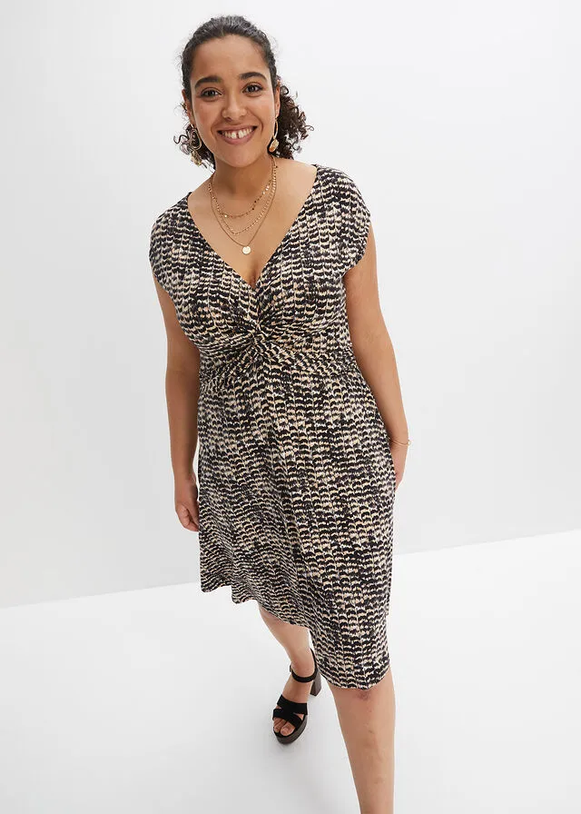 VESTIDO DE PUNTO BEIGENEGRO CON ESTAMPADO DE CEBRA