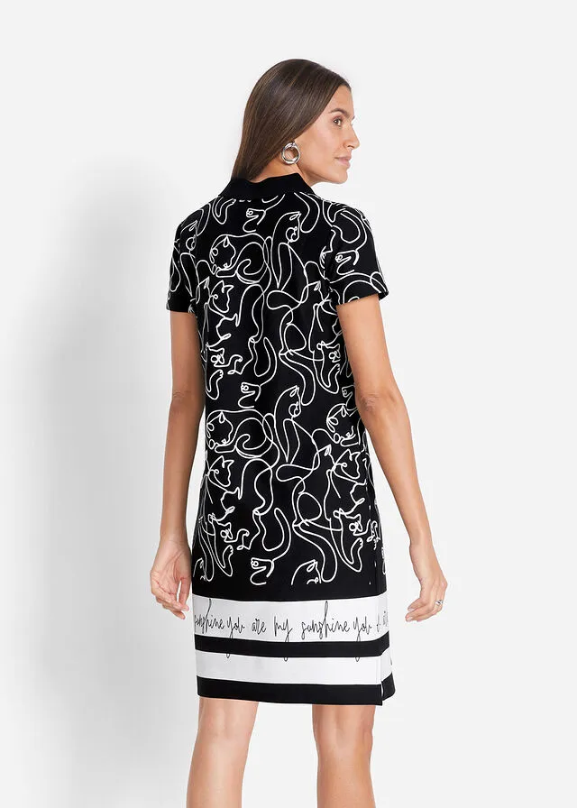 VESTIDO TIPO POLO CON LETRAS NEGROBLANCO ESTAMPADO