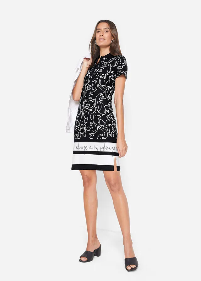 VESTIDO TIPO POLO CON LETRAS NEGROBLANCO ESTAMPADO